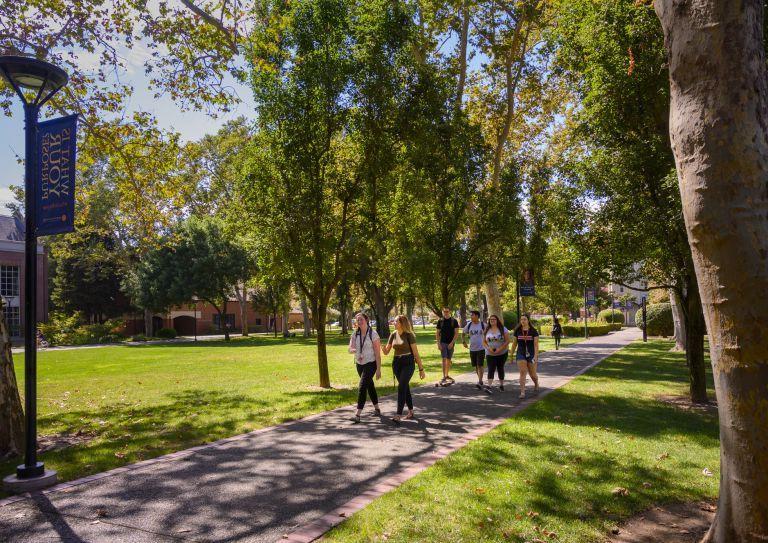 students walk on campus